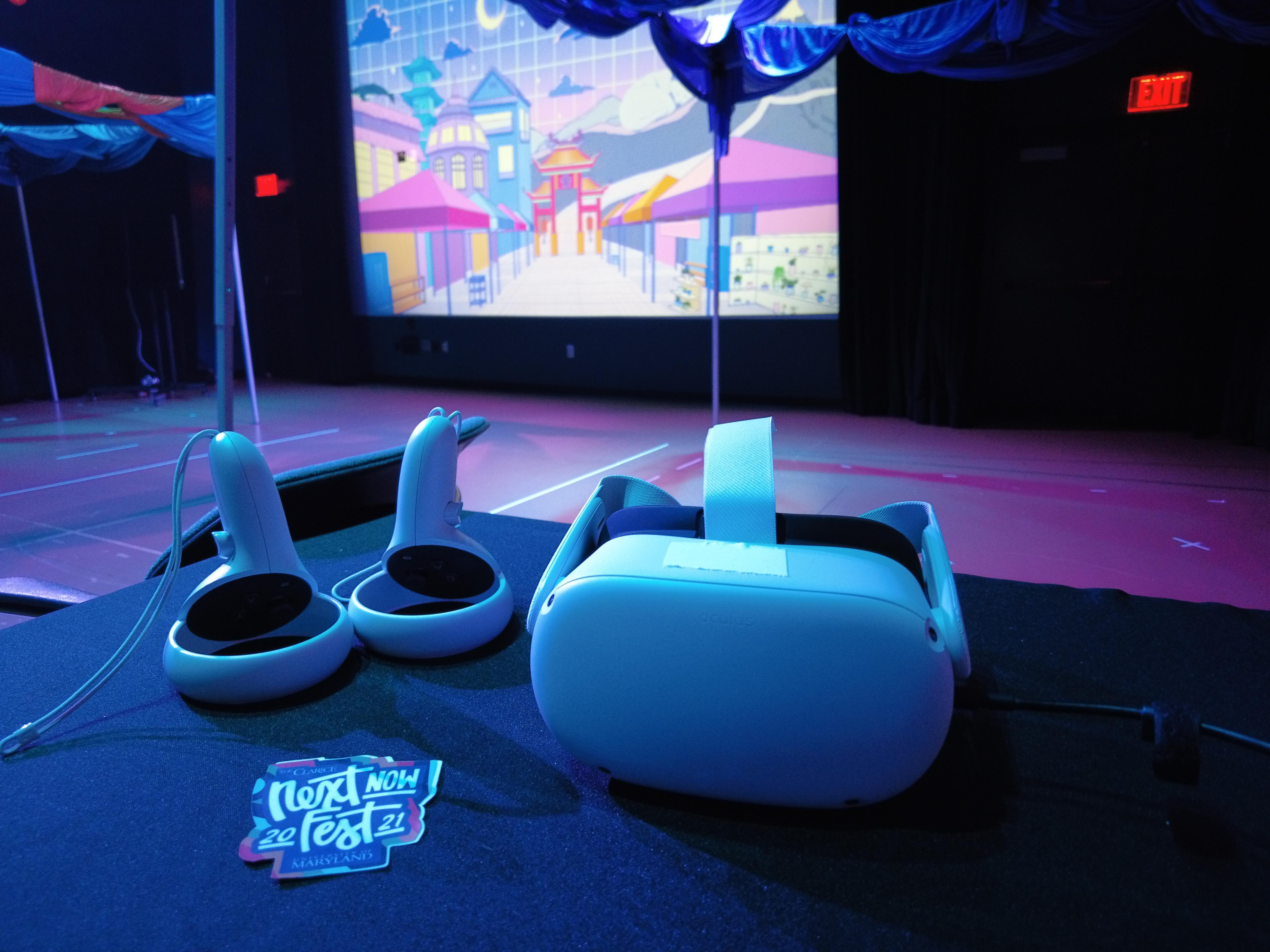 A photo of a white Oculus Quest headset and controllers with a Next Now Fest 2021 sticket