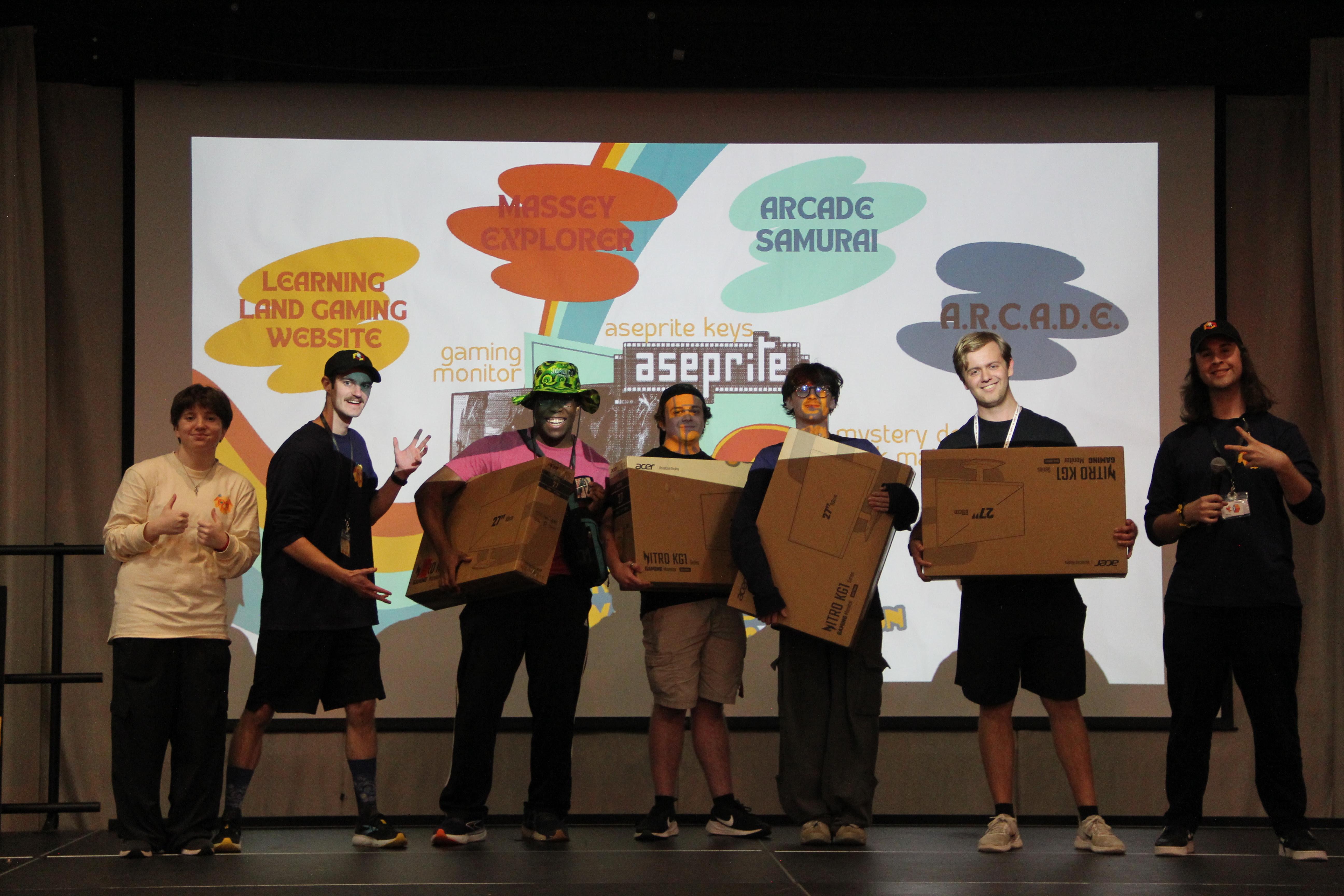 From left to right: Bella Goltser, HackUMBC president Sam Mengel, UMBC Game Developers Club vice president Samuel Wiggins Kadan Knapp Daryn Rowse Declan Scott Rick Jenkins, UMBC Game Developers Club president